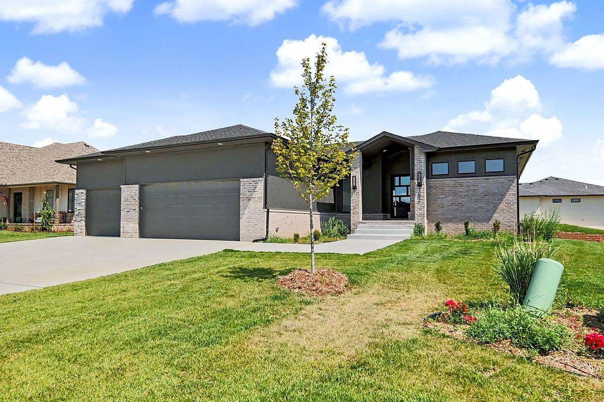 Finished, move-in-ready RJ Castle Homes new home for sale with a three-car garage and landscaped yard – Wichita, KS