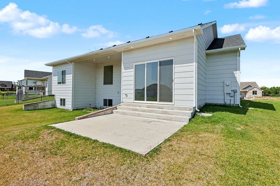 Rear exterior and covered patio at 2640 S Clear Creek St. — Wichita, KS