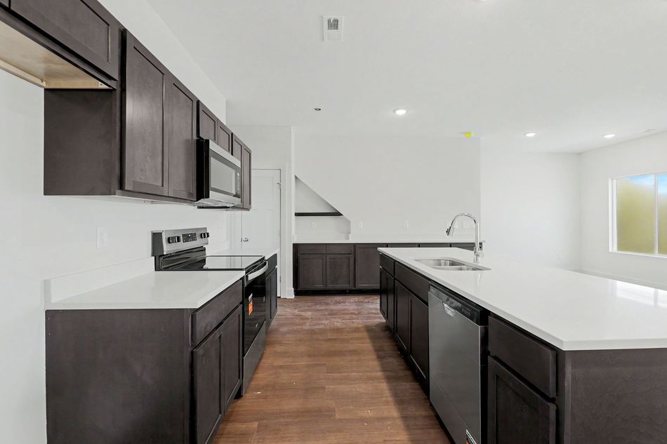 Kitchen with island and stainless appliances at 2927 S Cedar Crest St. — Wichita, KS