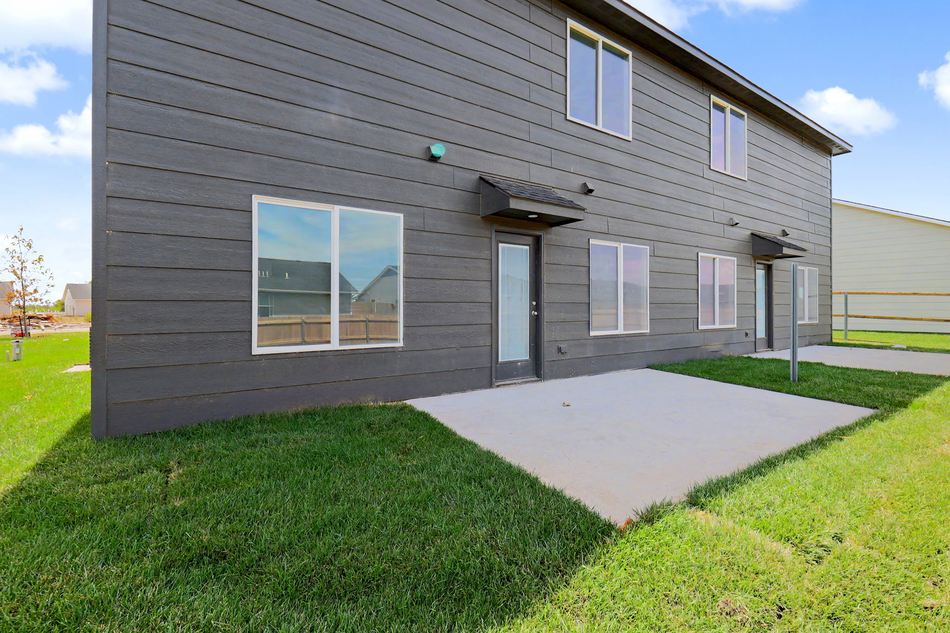 Rear exterior and covered patio at 2927 S Cedar Crest St. — Wichita, KS