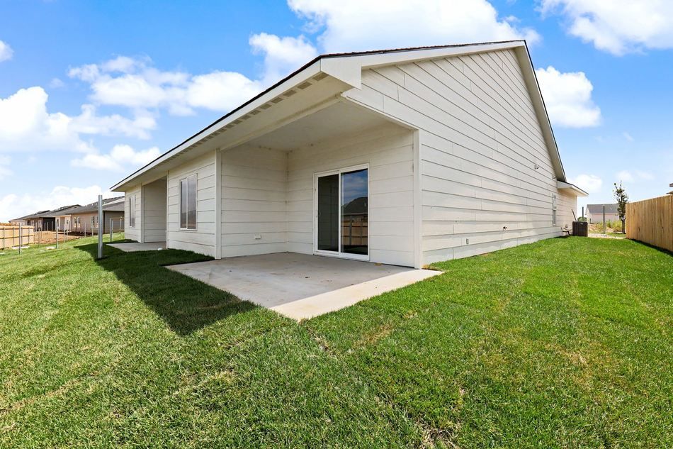 Covered rear patio and back lawn at 2931 S Cedar Crest St. — Wichita, KS