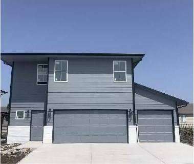 Completed RJ Castle Homes two-story home at 9708 E Annabelle St with three-car garage – Chalet Ridge – Wichita, KS