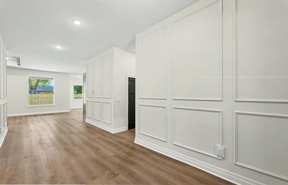Hallway at 116 S Byron Road by RJ Castle Homes panelled floor to ceiling in white board-and-batten millwork – Wichita, KS