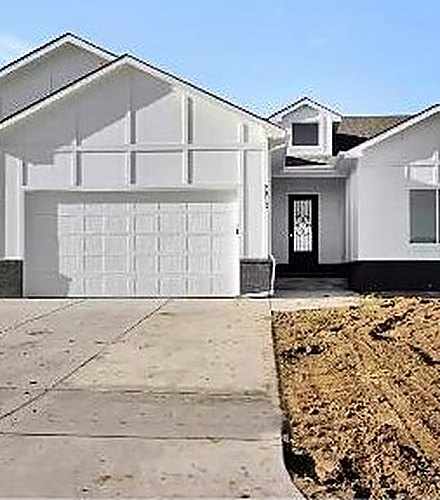 RJ Castle Homes new build in a Wichita, KS home community with a two-car garage