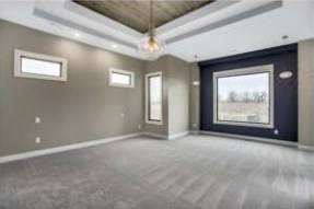 RJ Castle Homes master bedroom with tray ceiling and picture window – Wichita, KS