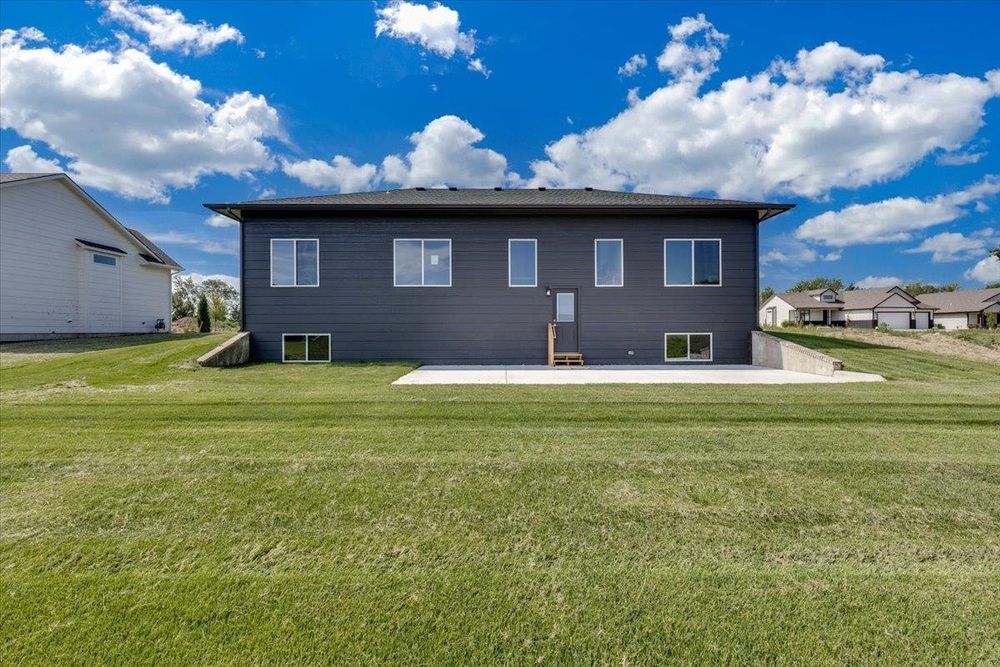 Rear exterior and back yard at 8880 E Bradford St, Derby, KS