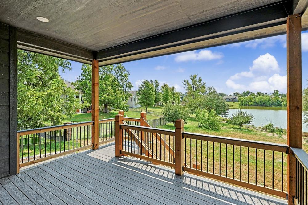 Covered rear deck looking out over the lake at the RJ Castle home on Sunflower Drive – Derby, KS