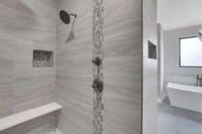 Completed RJ Castle Homes tile shower with built-in bench and niches – Wichita, KS