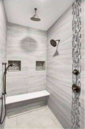 Walk-in tile shower with dual shower heads, bench and mosaic accent strip – RJ Castle Homes – Wichita, KS